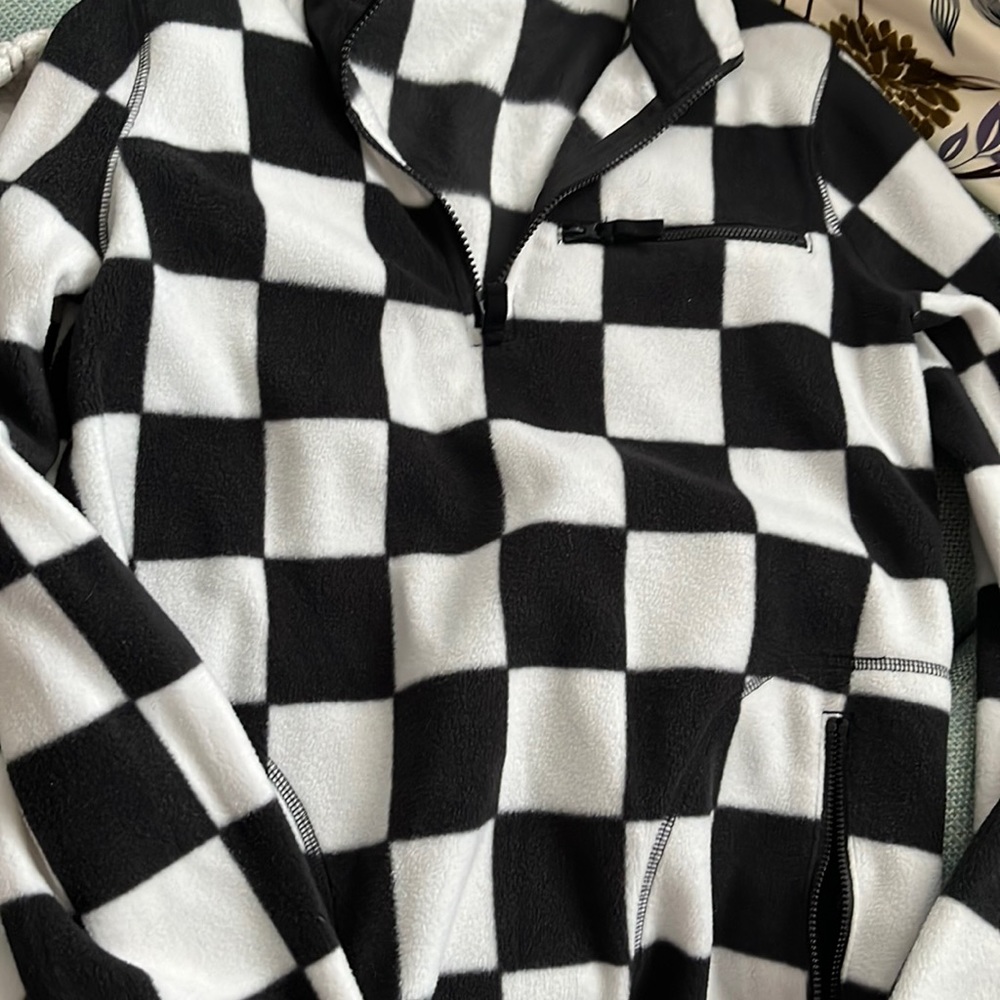Black and white checkered fleece pull over. Worn once. No rips or stains